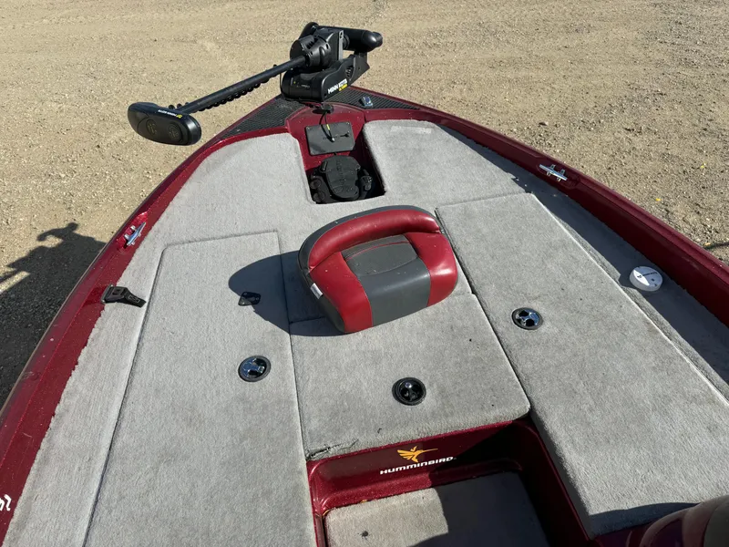 Slide: The Image of 2008 Triton 17 Explorer boat deck with trolling motor and seating. - 10