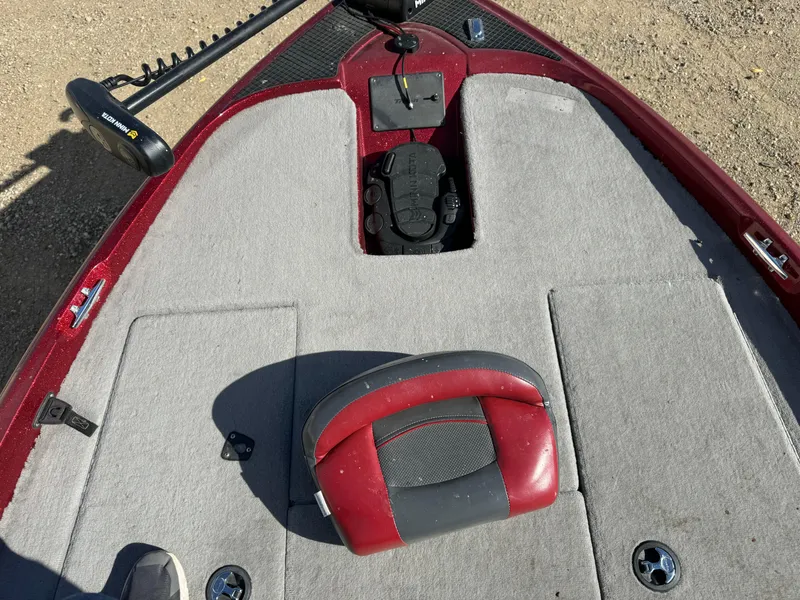 Slide: The Image of 2008 Triton 17 Explorer boat deck with red and gray seating. - 12