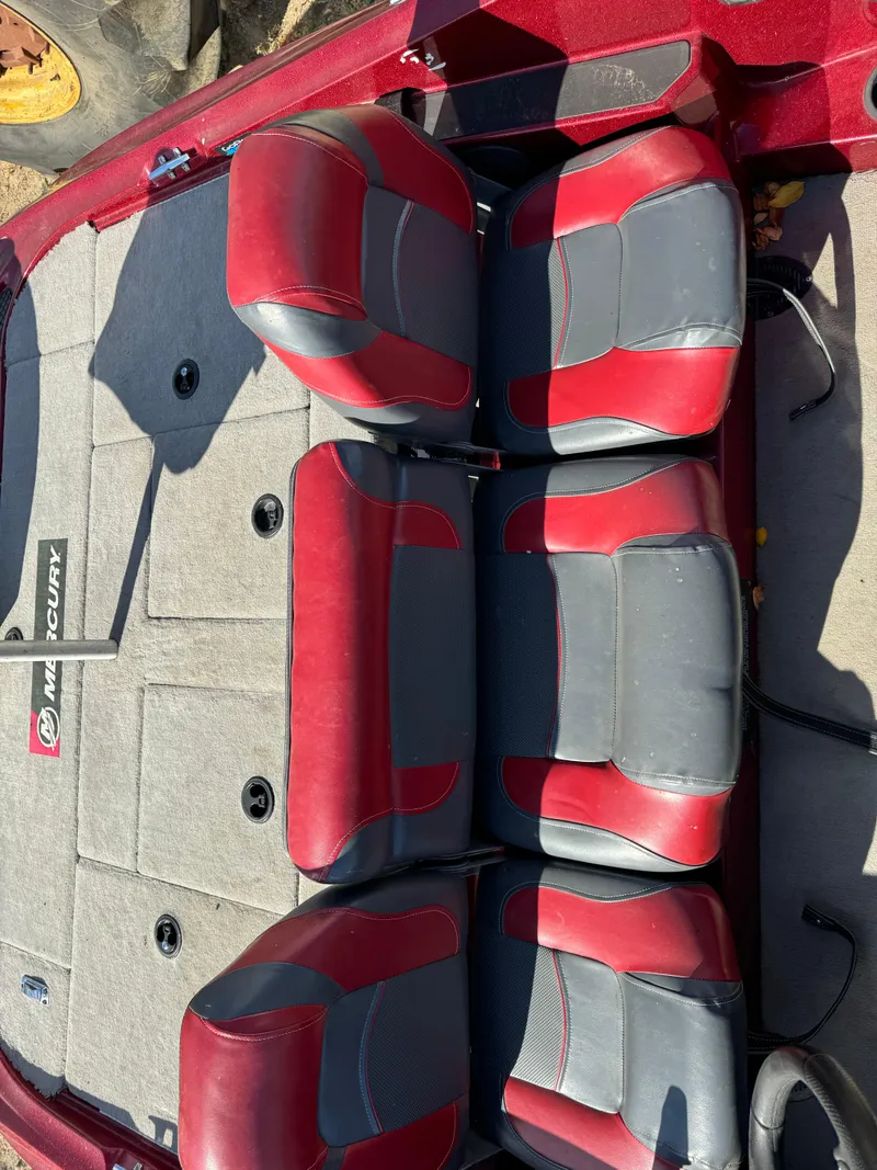Slide: The Image of 2008 Triton 17 Explorer boat interior with red and gray seating. - 6