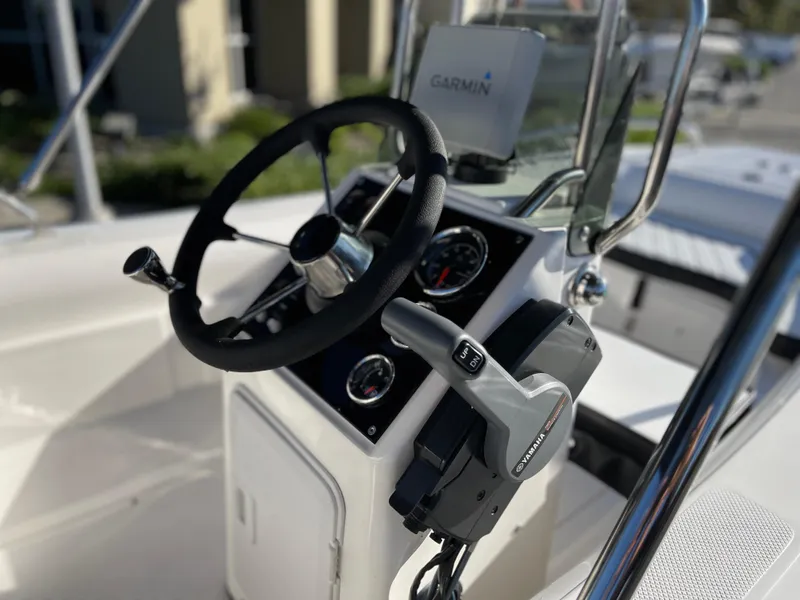 Slide: The Image of Steering console of a 1998 Rendova 14 boat with Garmin navigation system. - 16