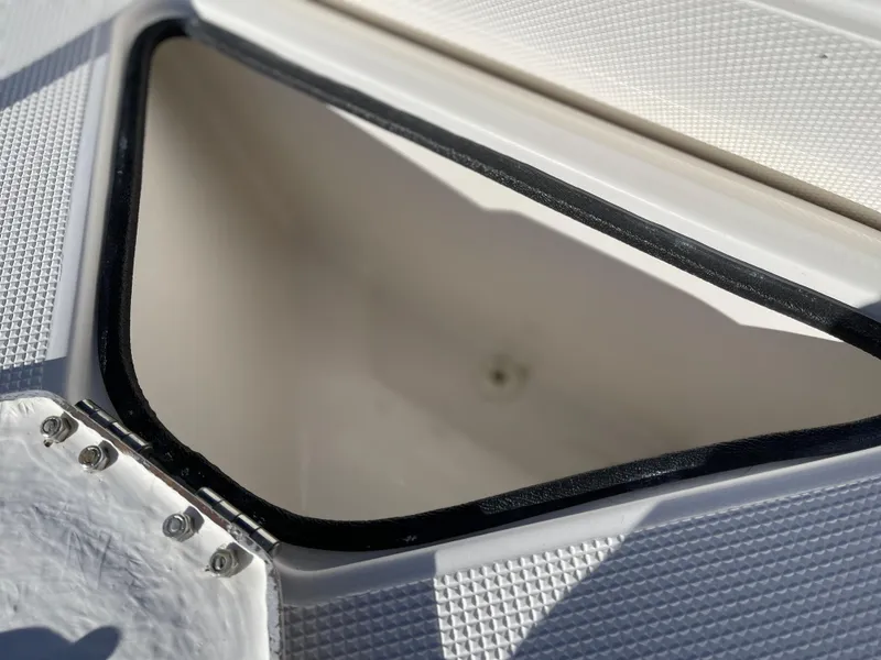Slide: The Image of Open storage compartment on a 1998 Rendova 14 boat deck. - 21