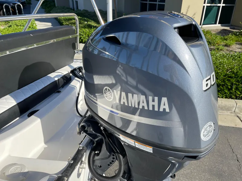 Slide: The Image of Yamaha 60 horsepower outboard motor on a 1998 Rendova 14 boat. - 3