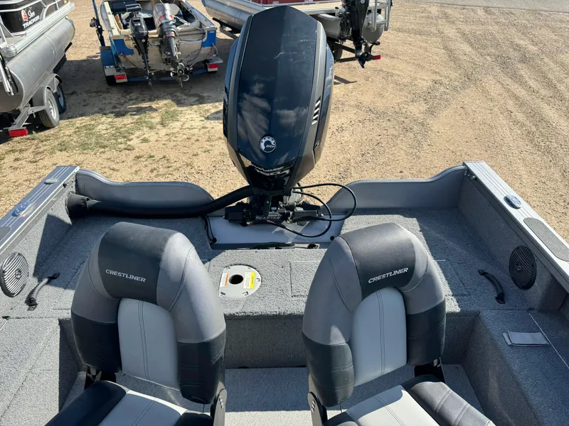 Slide: The Image of 2018 Crestliner 1850 Fish Hawk WT boat interior with motor and seating. - 10