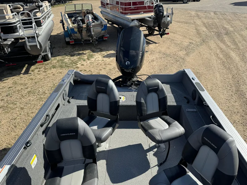Slide: The Image of 2018 Crestliner 1850 Fish Hawk WT boat with four seats and outboard motor. - 14
