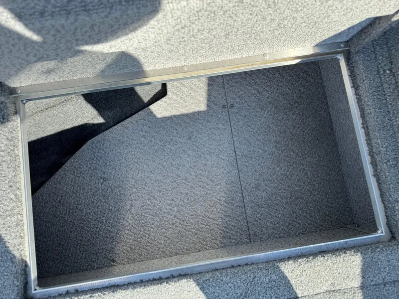 Slide: The Image of Open storage compartment in 2018 Crestliner 1850 Fish Hawk WT boat. - 18