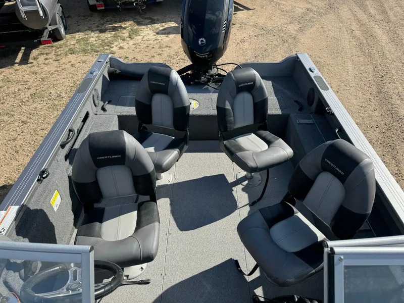 Slide: The Image of 2018 Crestliner 1850 Fish Hawk WT boat interior with four seats and motor. - 22