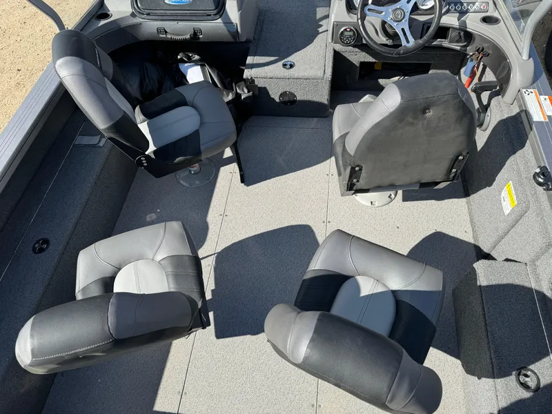 Slide: The Image of 2018 Crestliner 1850 Fish Hawk WT interior with four gray and black seats. - 23
