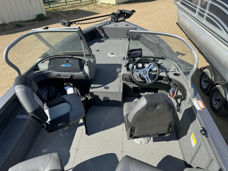 Slide: The Image of 2018 Crestliner 1850 Fish Hawk WT interior with steering console and seating. - 24