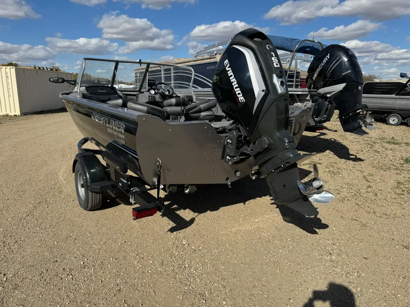 Slide: The Image of 2018 Crestliner 1850 Fish Hawk WT boat with Evinrude engine, parked outdoors. - 3