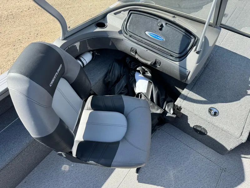 Slide: The Image of 2018 Crestliner 1850 Fish Hawk WT interior with seating and storage compartment. - 8