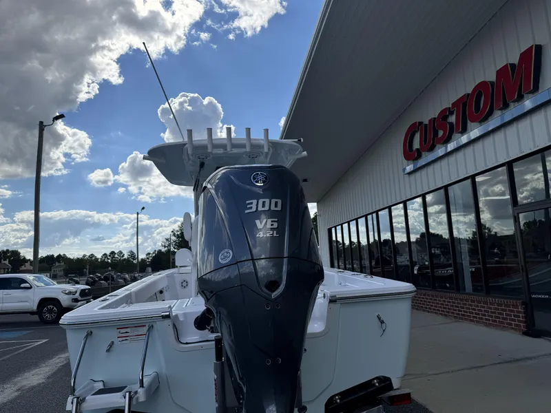 Slide: The Image of 2025 Sportsman Masters 247 Bay Boat with 300 HP engine outside dealership. - 15