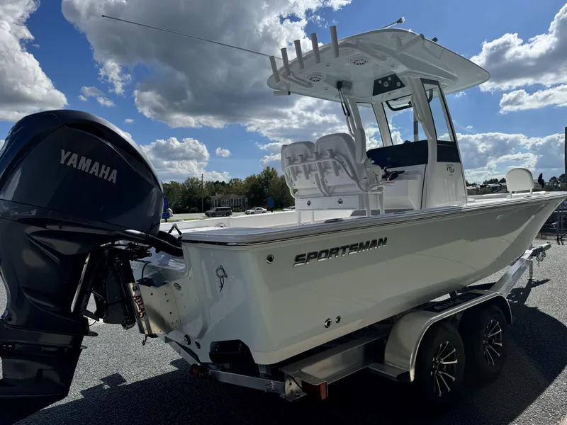 Slide: The Image of 2025 Sportsman Masters 247 Bay Boat with Yamaha engine on trailer under cloudy sky. - 5