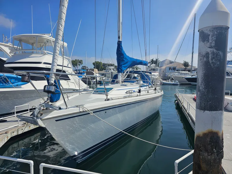 Slide: The Image of Sailboat docked in marina, Catalina 42 model, 1990, with blue sail cover. - 1
