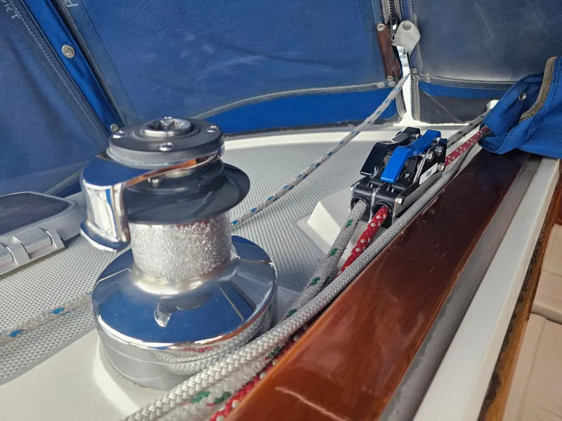 Slide: The Image of Sailing equipment on a 1990 Catalina 42 yacht, featuring winch and rope system. - 12