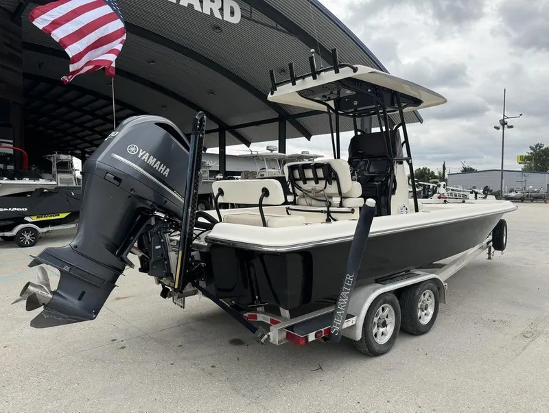 Slide: The Image of 2013 ShearWater LTZ Series 25 boat with Yamaha engine on trailer. - 12