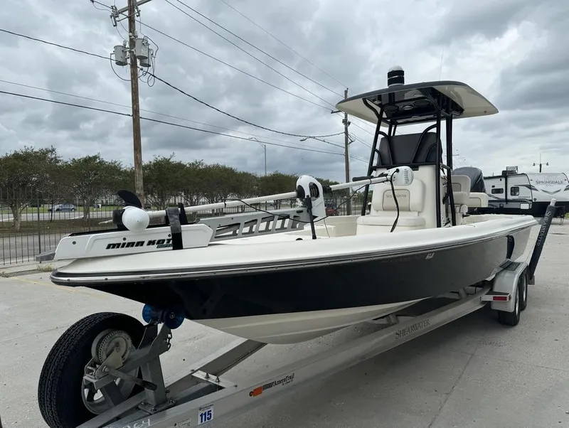 Slide: The Image of 2013 ShearWater LTZ Series 25 boat on trailer, overcast sky background. - 14