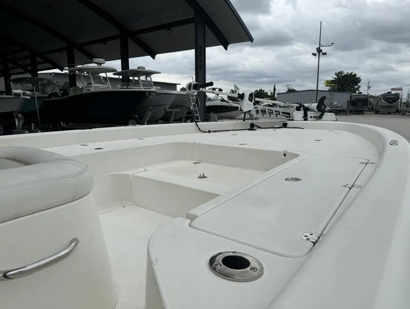 Slide: The Image of 2013 ShearWater LTZ Series 25 boat deck under cloudy sky at marina. - 17