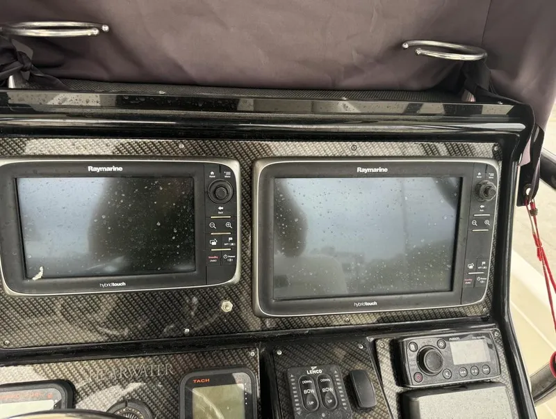 Slide: The Image of 2013 ShearWater LTZ Series 25 dashboard with Raymarine hybrid touch displays. - 18