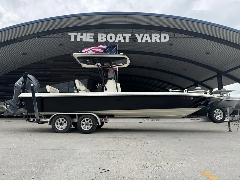 Slide: The Image of 2013 ShearWater LTZ Series 25 boat on trailer at The Boat Yard. - 2
