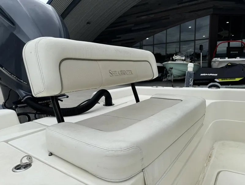 Slide: The Image of ShearWater LTZ Series 25 boat seat, 2013 model, with white upholstery and visible engine. - 9