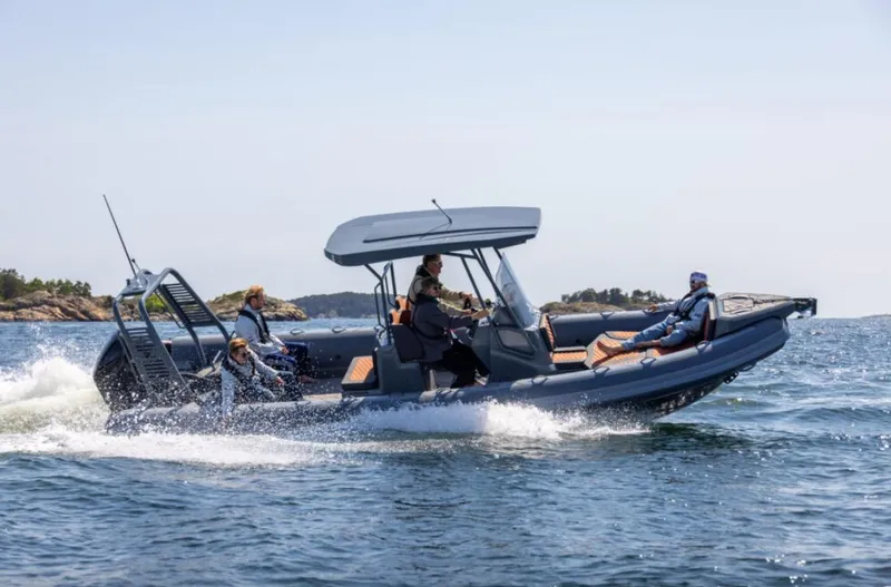 The Image of 2025 Highfield Sport 760 boat cruising on open water with passengers. - 0