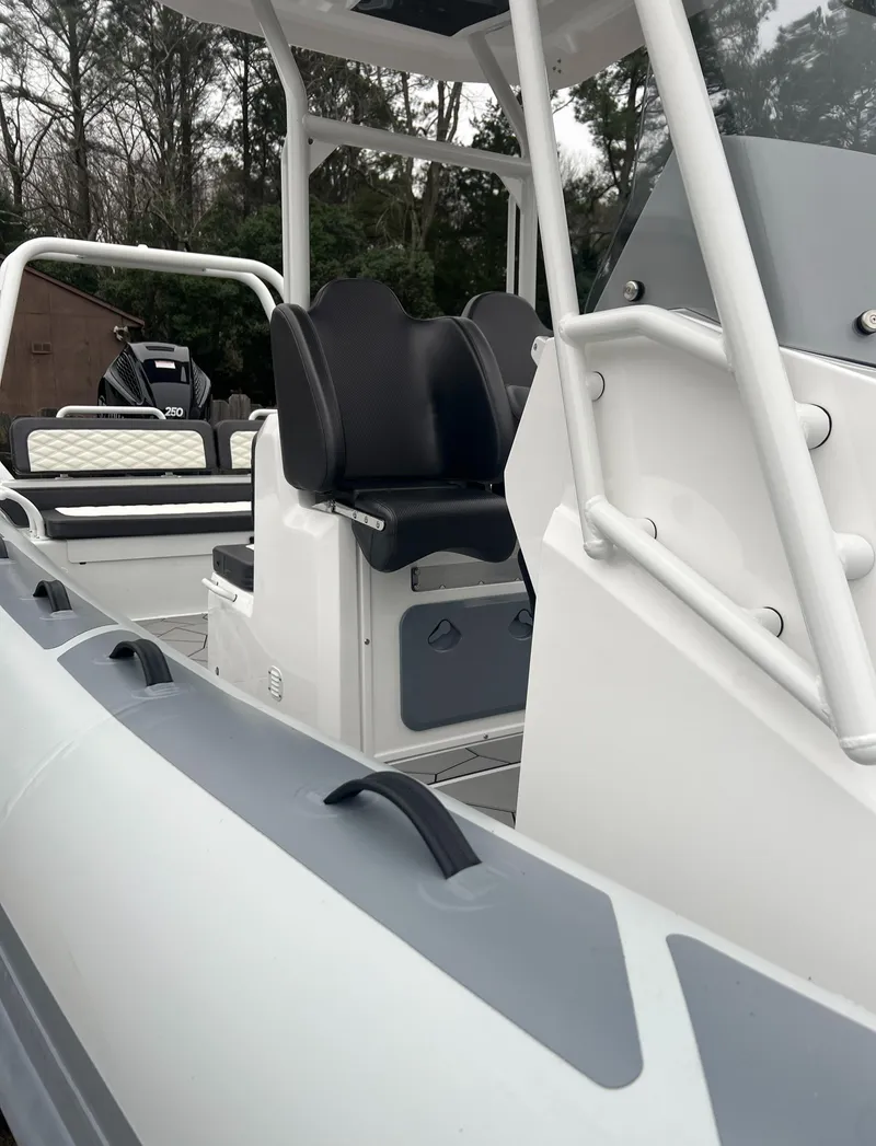 Slide: The Image of 2025 Highfield Sport 760 boat interior with sleek seating and modern design. - 10