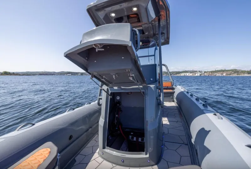 Slide: The Image of 2025 Highfield Sport 760 boat on water, open storage compartment, modern design. - 3