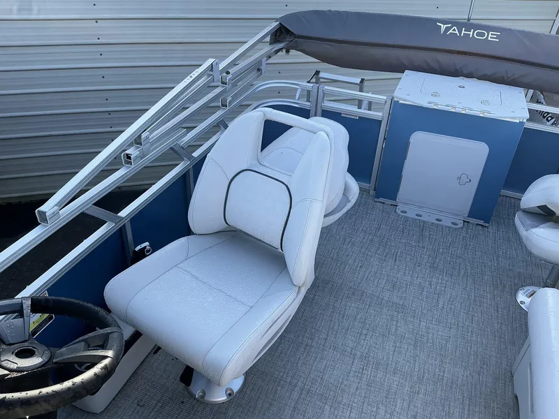 Slide: The Image of 2025 Tahoe Pontoon Boats Sport 17 REAR FISH interior with steering wheel and seating. - 8