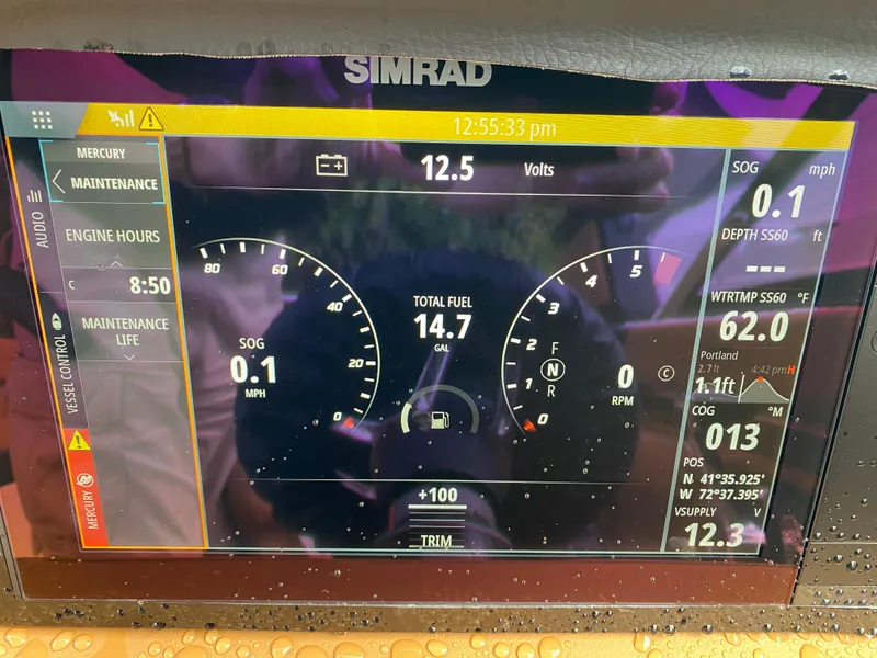 Slide: The Image of Simrad display on 2024 Chaparral 267 SSX showing engine metrics and navigation data. - 14