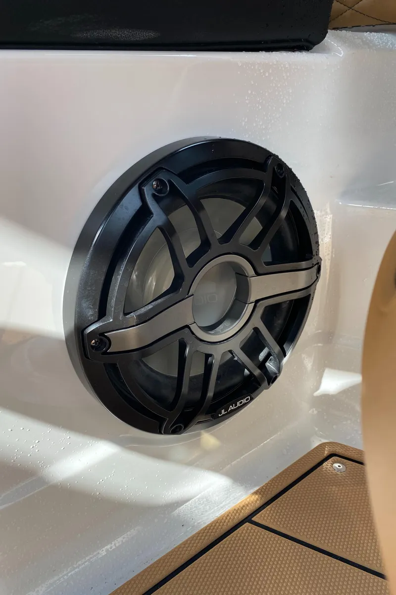Slide: The Image of 2024 Chaparral 267 SSX boat speaker detail, black grille on white panel. - 19