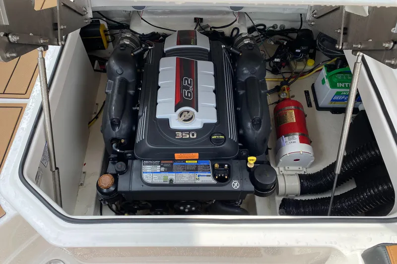 Slide: The Image of 2024 Chaparral 267 SSX engine compartment with 8.2L engine and safety equipment. - 21