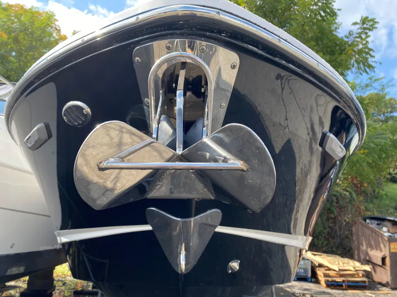 Slide: The Image of 2024 Chaparral 267 SSX boat with stainless steel anchor, close-up view. - 3