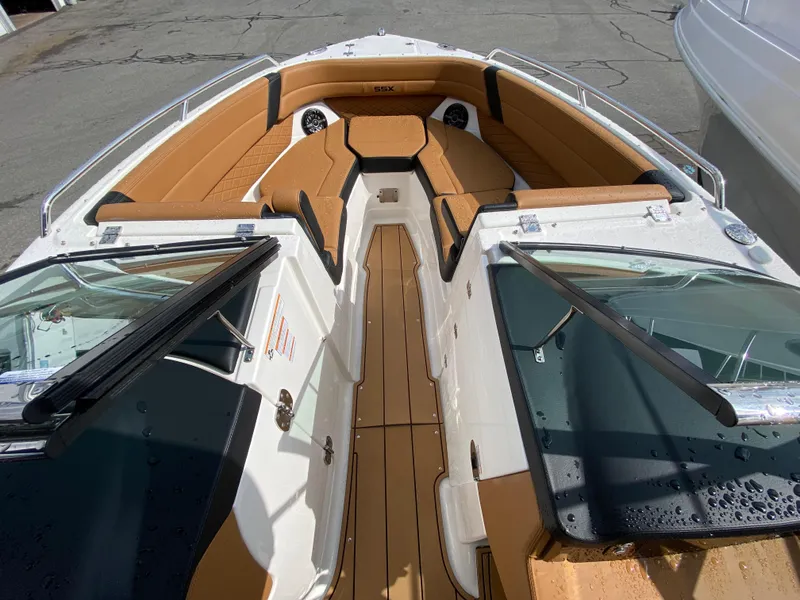 Slide: The Image of 2024 Chaparral 267 SSX boat interior with tan seating and sleek design. - 8