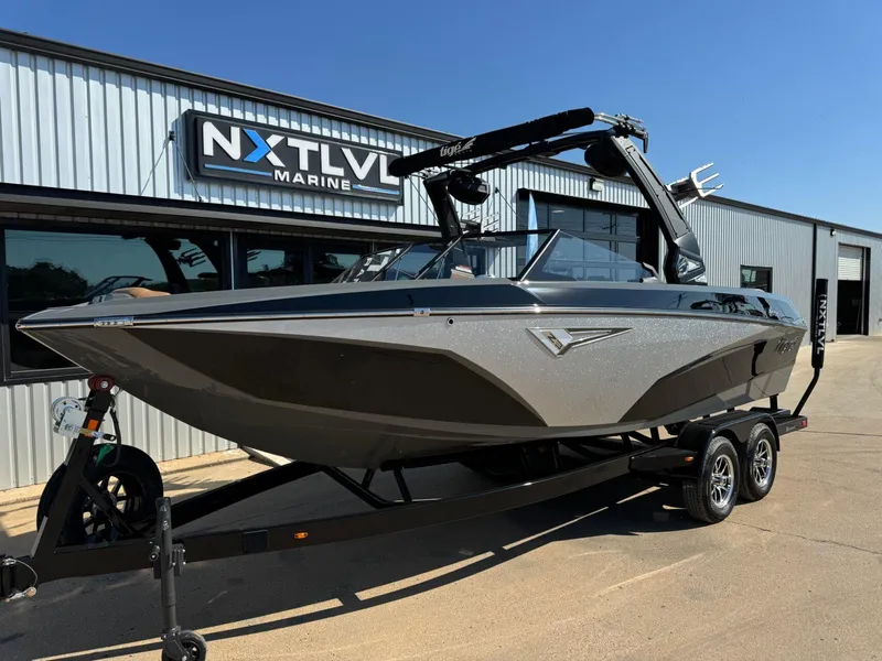Slide: The Image of 2024 Tigé Z3 boat on trailer at NXT LVL Marine dealership. - 1