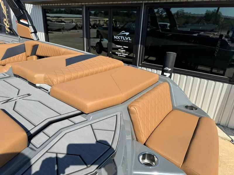 Slide: The Image of 2024 Tigé Z3 boat with tan seating and modern design at NXT LVL Marine. - 11