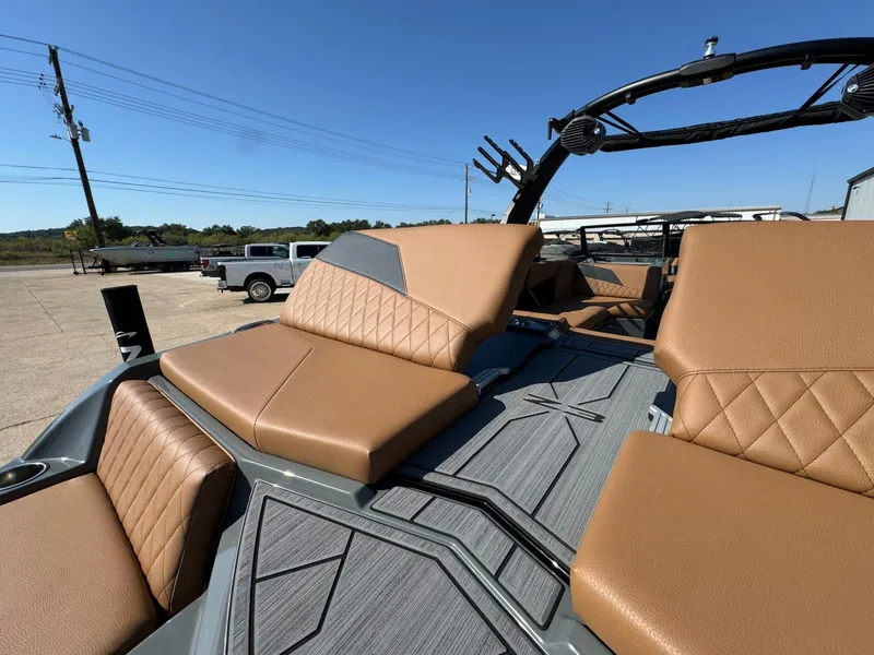 Slide: The Image of 2024 Tigé Z3 boat interior with tan leather seats and sleek design. - 13