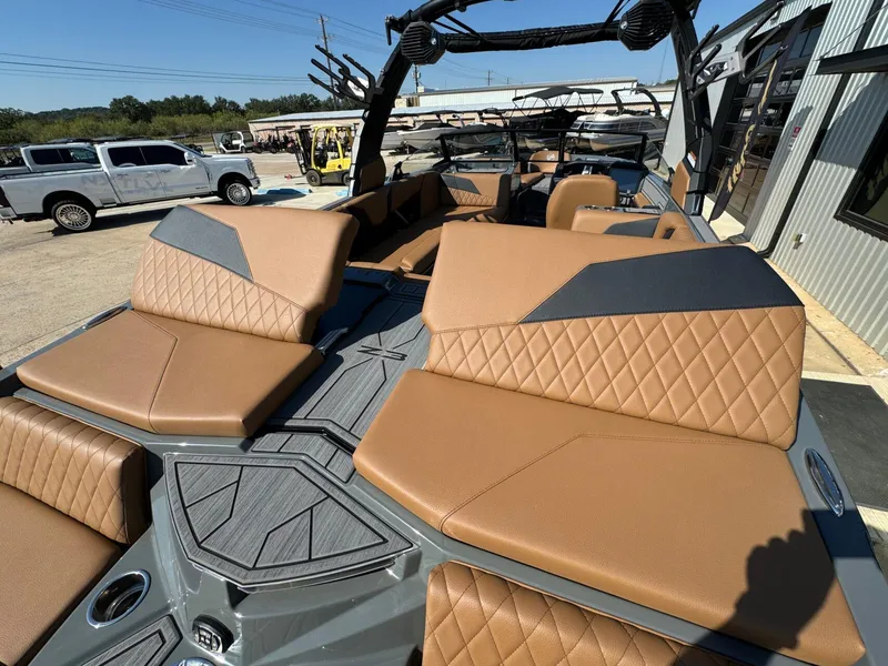 Slide: The Image of 2024 Tigé Z3 boat interior with tan diamond-stitched seats and sleek design. - 14