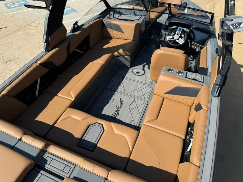 Slide: The Image of 2024 Tigé Z3 boat interior with tan leather seats and modern dashboard. - 15