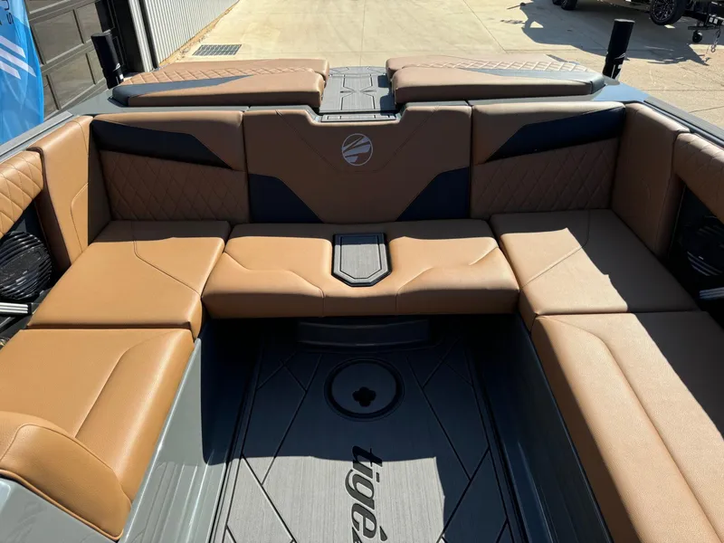 Slide: The Image of 2024 Tigé Z3 boat interior with tan leather seating and modern design. - 17