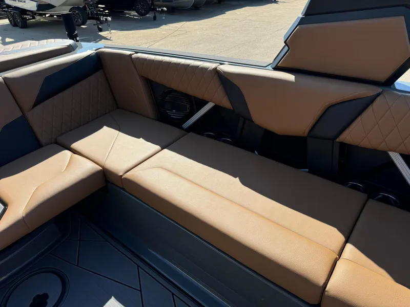 Slide: The Image of 2024 Tigé Z3 boat interior with tan leather seating and modern design. - 18