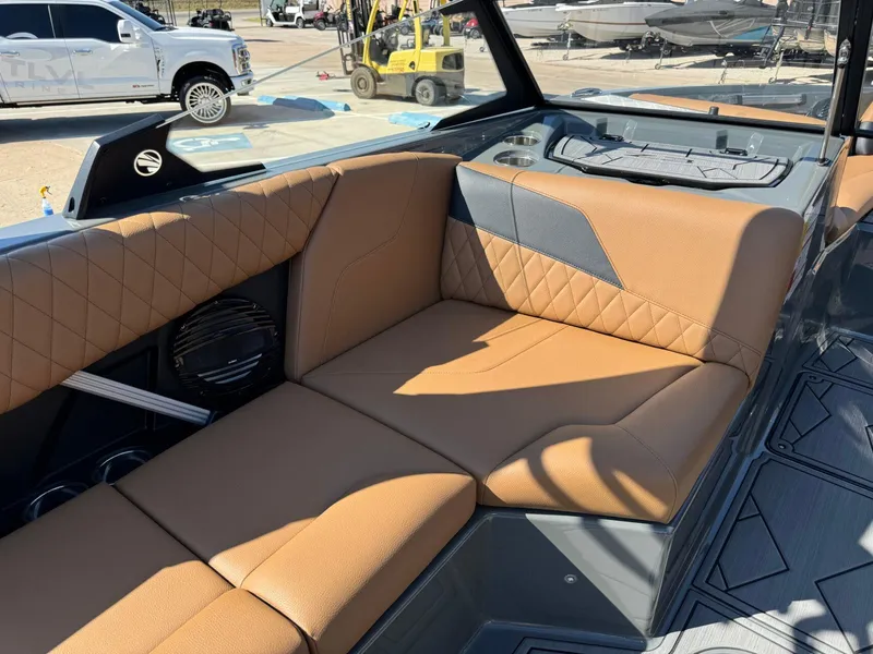 Slide: The Image of 2024 Tigé Z3 boat interior with tan leather seating and modern design. - 19
