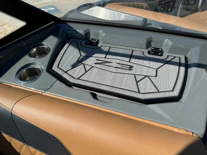 Slide: The Image of 2024 Tigé Z3 boat interior with cup holders and stylish dashboard design. - 20