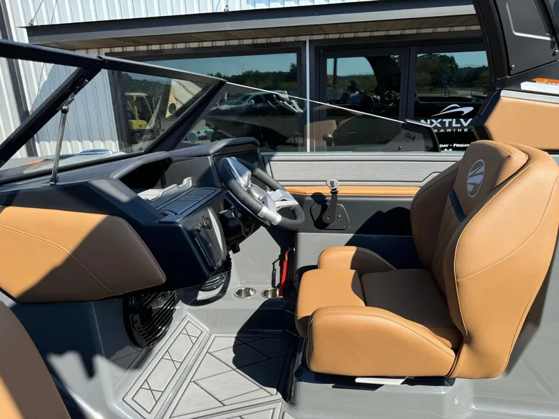 Slide: The Image of 2024 Tigé Z3 boat interior with tan seats and modern dashboard design. - 23