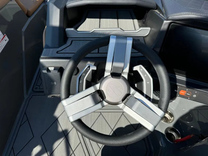 Slide: The Image of Steering wheel of 2024 Tigé Z3 boat, featuring modern design and controls. - 25