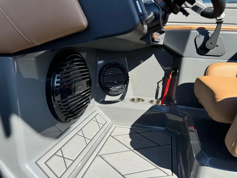 Slide: The Image of 2024 Tigé Z3 boat interior with speakers and tan seating. - 26