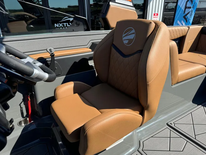 Slide: The Image of 2024 Tigé Z3 boat interior with tan leather seating and steering wheel. - 27