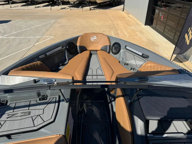 Slide: The Image of 2024 Tigé Z3 boat interior with tan seating and modern design features. - 28