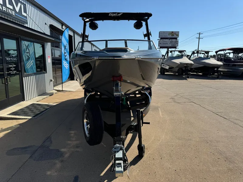 Slide: The Image of 2024 Tigé Z3 boat on trailer at dealership, sunny day. - 8