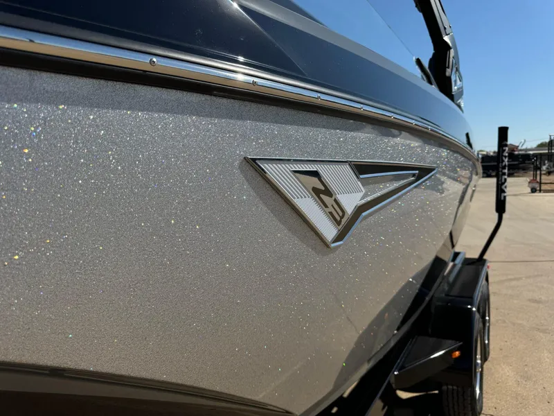 Slide: The Image of 2024 Tigé Z3 boat with sparkling silver finish and sleek design. - 9
