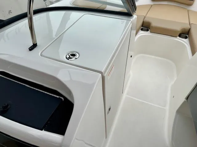 Slide: The Image of 2025 Bayliner VR6 Bowrider I/O interior, featuring sleek white design and comfortable seating. - 13